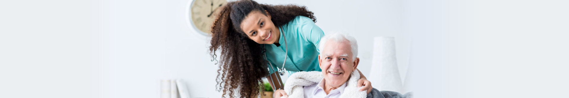 Smiling doctor caring about patient at home